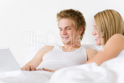 Bedroom - young couple with laptop