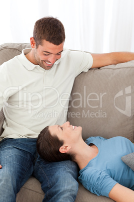 Lovely woman lying on the sofa with her boyfriend