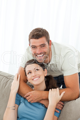 Portrait of an affectionate man with his girlfriend in the livin