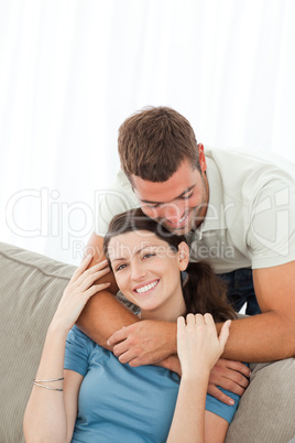 Portrait of a cute couple hugging in the living room
