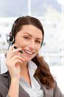 Beautiful businesswoman with headphones and smiling at the camer