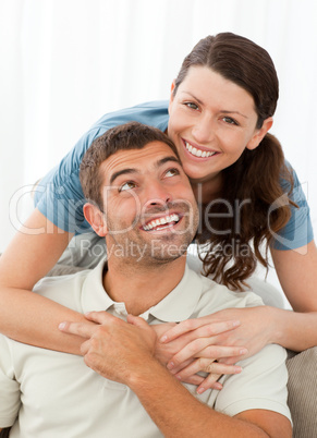 Portrait of a pretty woman hugging her husband