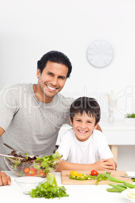 Portrait of a father and his son preparing their lunch
