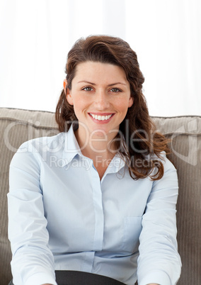 Beautiful businesswoman relaxing on the sofa