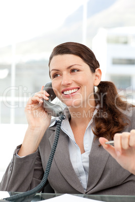 Cheerful usinesswoman talking on the phone