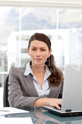 Woman on the computer looking at the camera