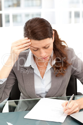 Worried businesswoman working at a table