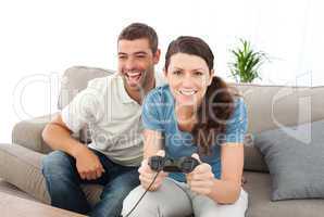 Portrait of a woman playing video game with her boyfriend