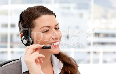 Pretty businesswoman with earpiece