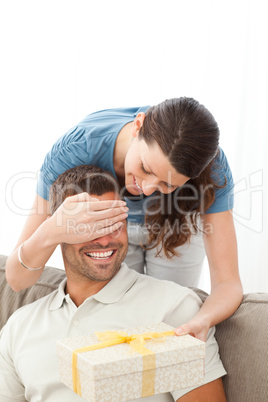 Beautful woman having a surprise for her husband