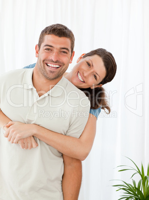 Portrait of a happy couple standing in the living room