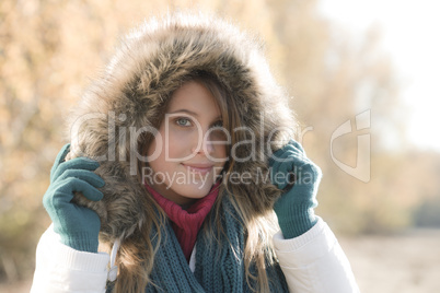 Winter fashion - woman with fur hood outside