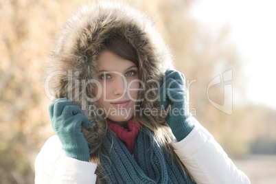 Winter fashion - woman with fur hood outdoors