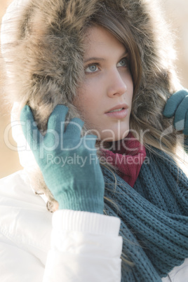 Winter fashion - woman with fur hood outdoors