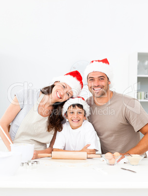 Happy family baking christmas cookies together