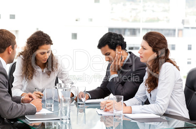 Multi ethnic business team working together during a meeting