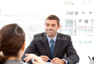 Two business people talking together during a meeting