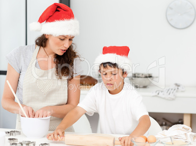 Mother and son preparing Christmas biscuits together