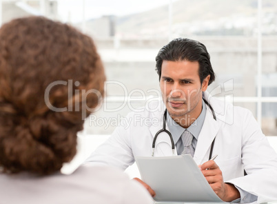 Charismatic doctor during an appointment with a female patient