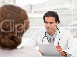 Charismatic doctor during an appointment with a female patient