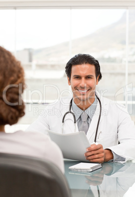 Positive doctor during a appointment with a female patient