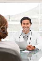 Positive doctor during a appointment with a female patient