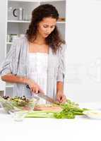 Lovely woman cutting vegetables in the kitchen