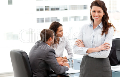 Happy businesswoman with her team during a meeting