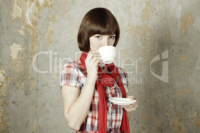 Young girl drinking coffee