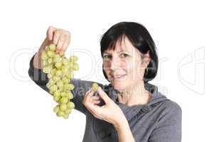 Retired woman eating grapes