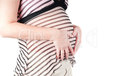 Pregnant woman hands in form of heart sign