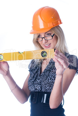 Woman in helmet with level