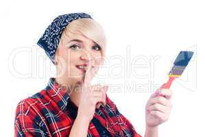 Young woman with paintbrush