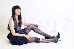 Young woman in torn stockings