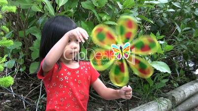 Little Asian Girl With A Pinwheel