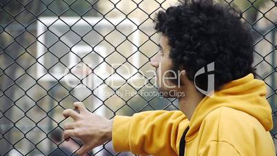 Young man watch basketball ball play streetball sport game