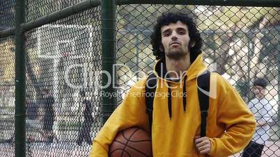 Young man play basketball streetball sport game action