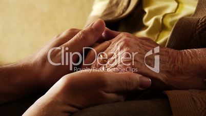 Senior old woman young man hold hand wrinkle skin close up   2
