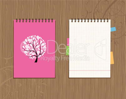 Notebook cover and page design on wooden background