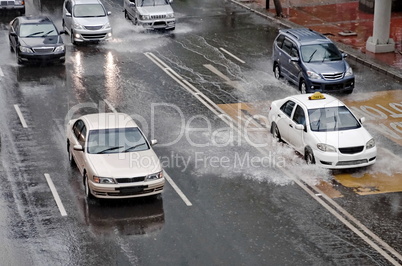 Car Driving On Flooded Street