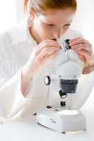 Microscope laboratory - woman medical research