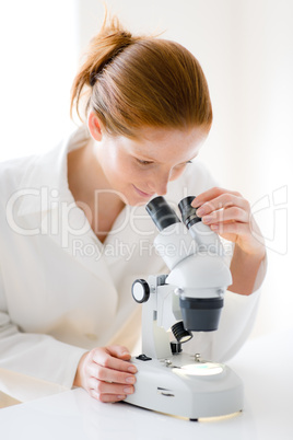 Microscope laboratory - woman medical research