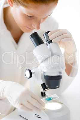 Microscope laboratory - woman medical research