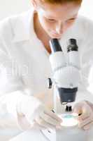 Microscope laboratory - woman medical research