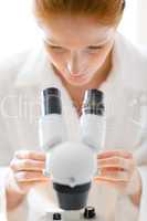 Microscope laboratory - woman medical research