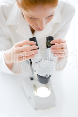 Microscope laboratory - woman medical research