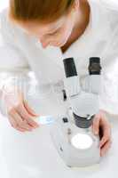 Microscope laboratory - woman medical research