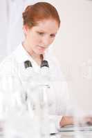 Microscope laboratory - woman medical research