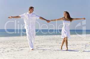 Happy Romantic Couple Dancing Holding Hands on A Tropical Beach