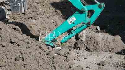 Excavator digging a trench